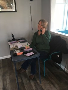 Smiling volunteers staffed the phone, taking orders