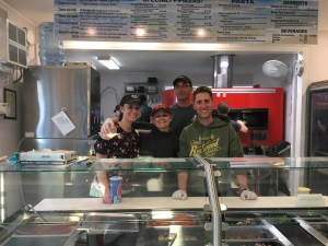 Volunteers working in the pizza kitchen